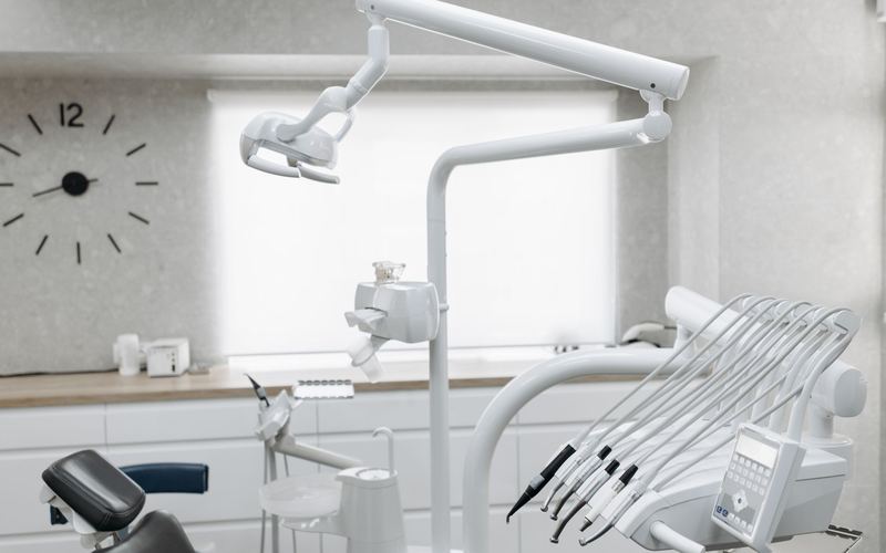 Modern dental operatory with treatment chair and equipment